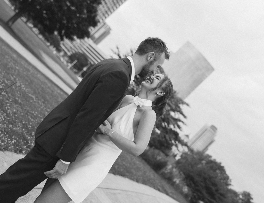 Seth dipping Bailey with the Milwaukee lakefront behind them