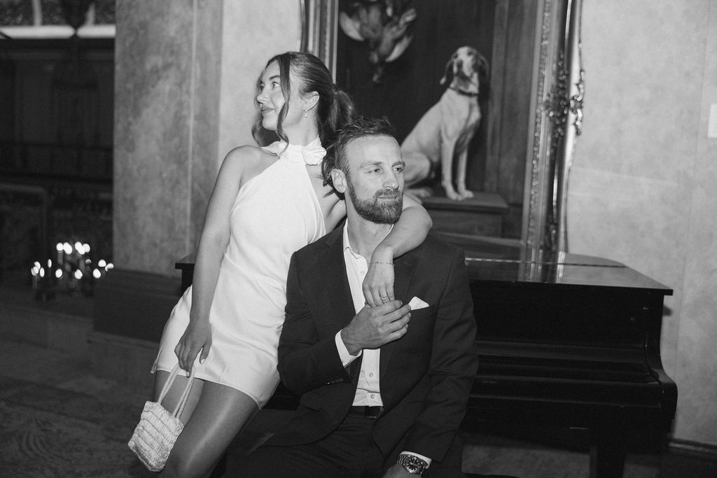Bailey and Seth at the piano in a Milwaukee ballroom